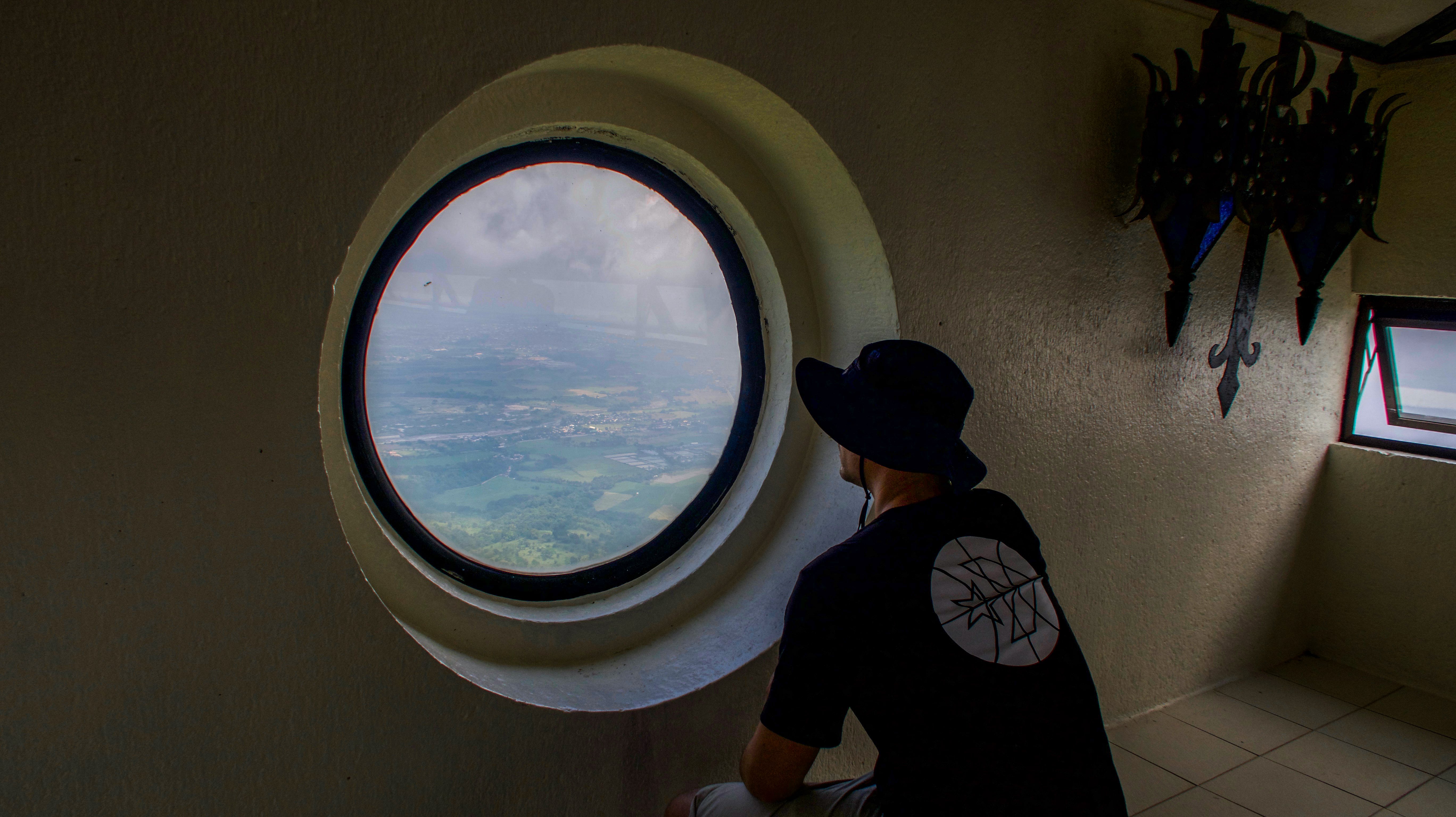 looking out of window at memorial cross mt samat bataan